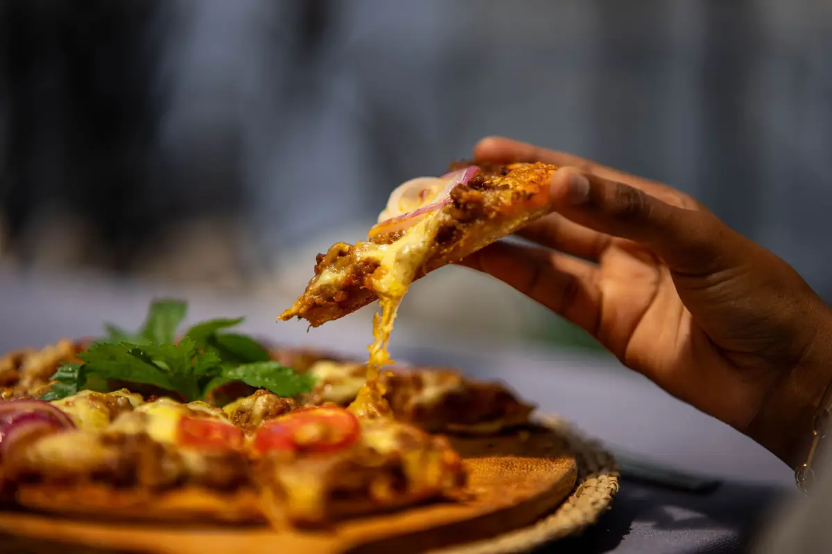 A slice of pizza at Mvuli Farm Lodge