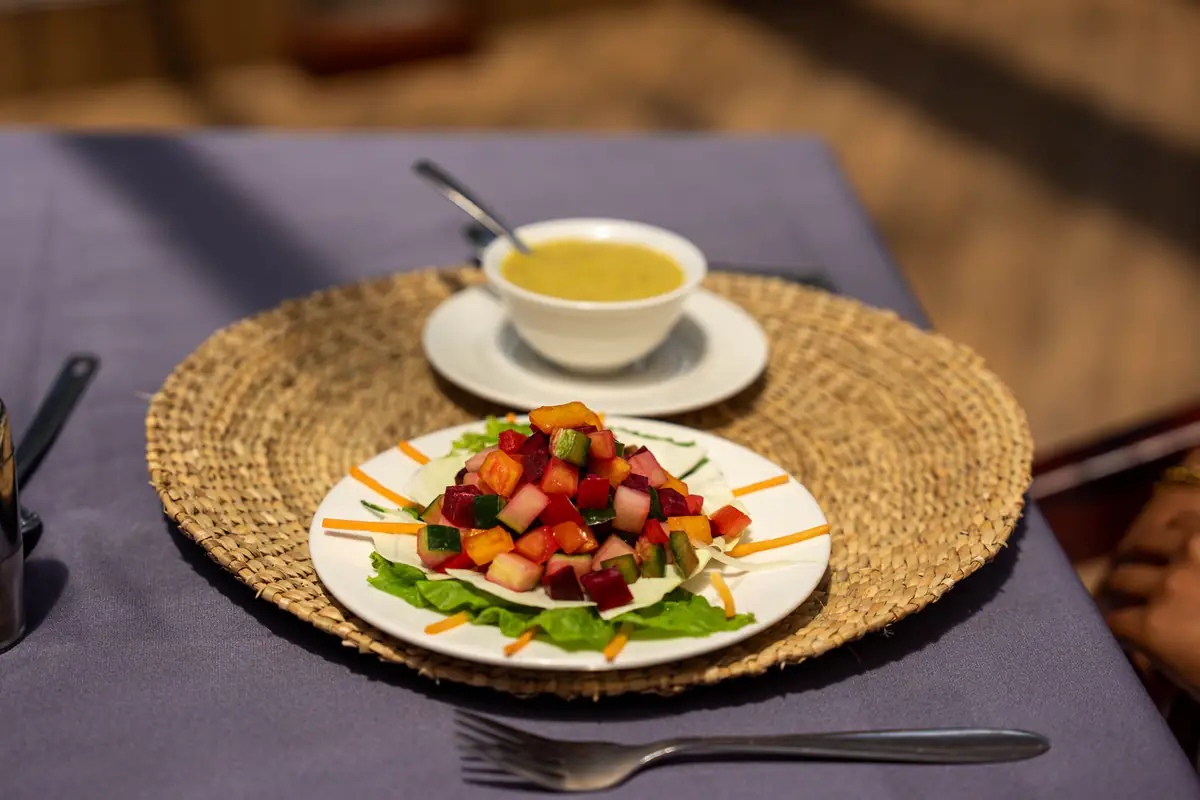 Fresh salad and soup, the Mvuli table