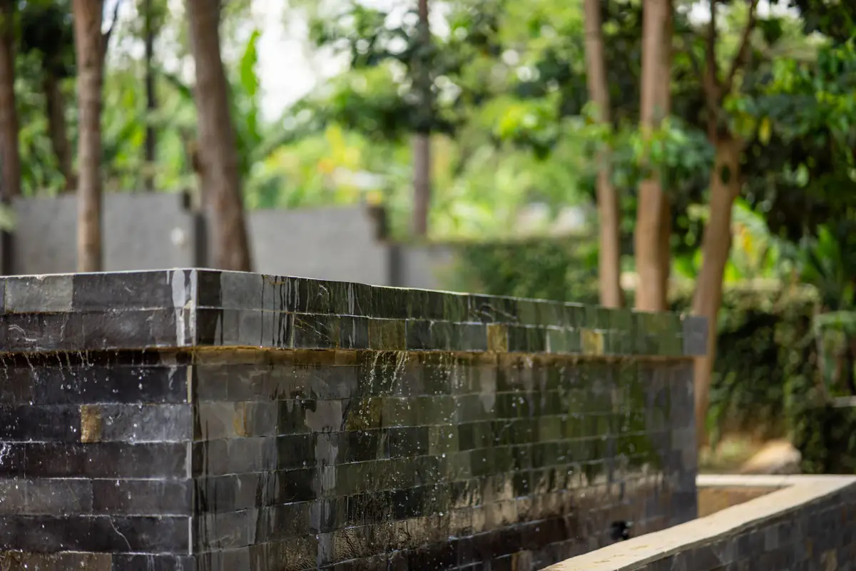 Stone wall in the gardens at Mvuli Farm Lodge